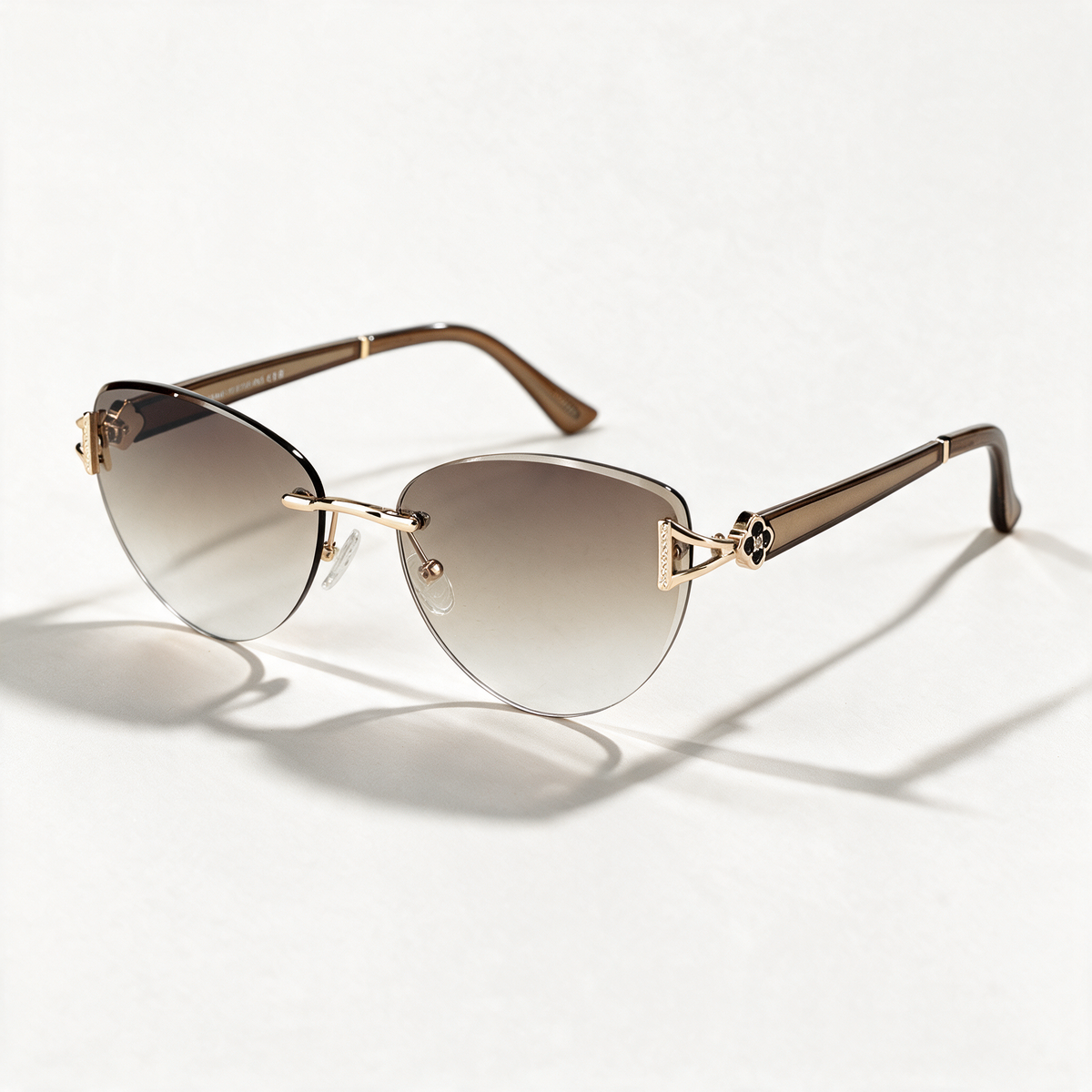The Blank Tag Marquise oversized rimless cat-eye sunglasses for women, gold with brown gradient lens – front view — view 1