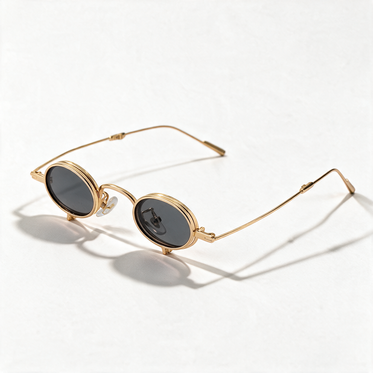 The Blank Tag Relic vintage micro round polarised sunglasses, gold with grey tinted lens – front view — view 1