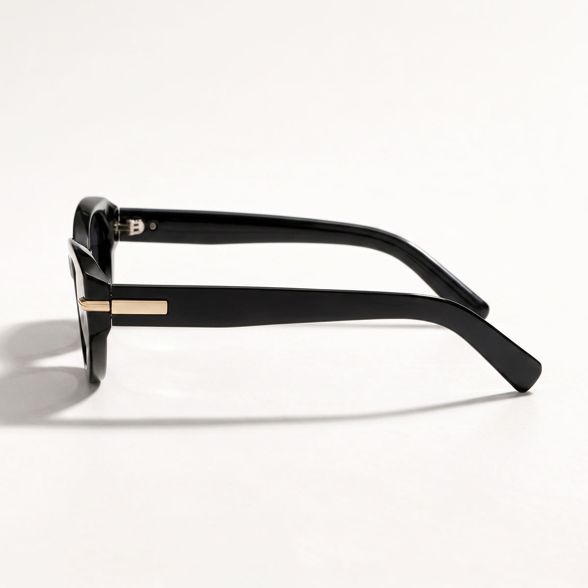 The Blank Tag Charmer black polarised cat-eye sunglasses for women with slim gold temple bar – angled view — view 2