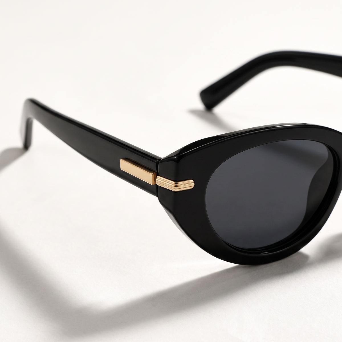 The Blank Tag Charmer black polarised cat-eye sunglasses for women with slim gold temple bar – detail view — view 3