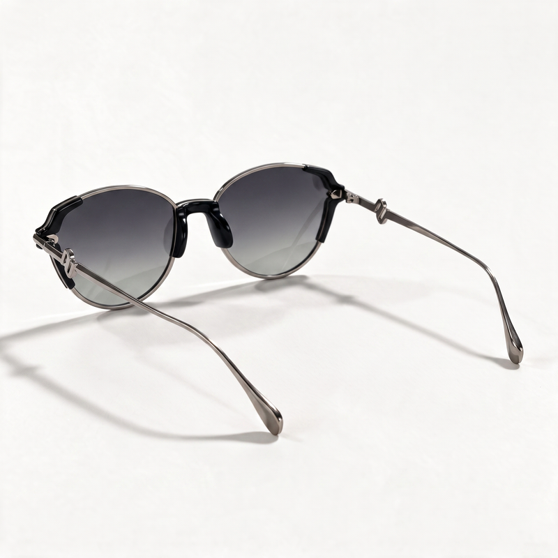 The Blank Tag Refined slim oval polarised sunglasses for women, black with gunmetal rim and grey gradient lens – detail view — view 4