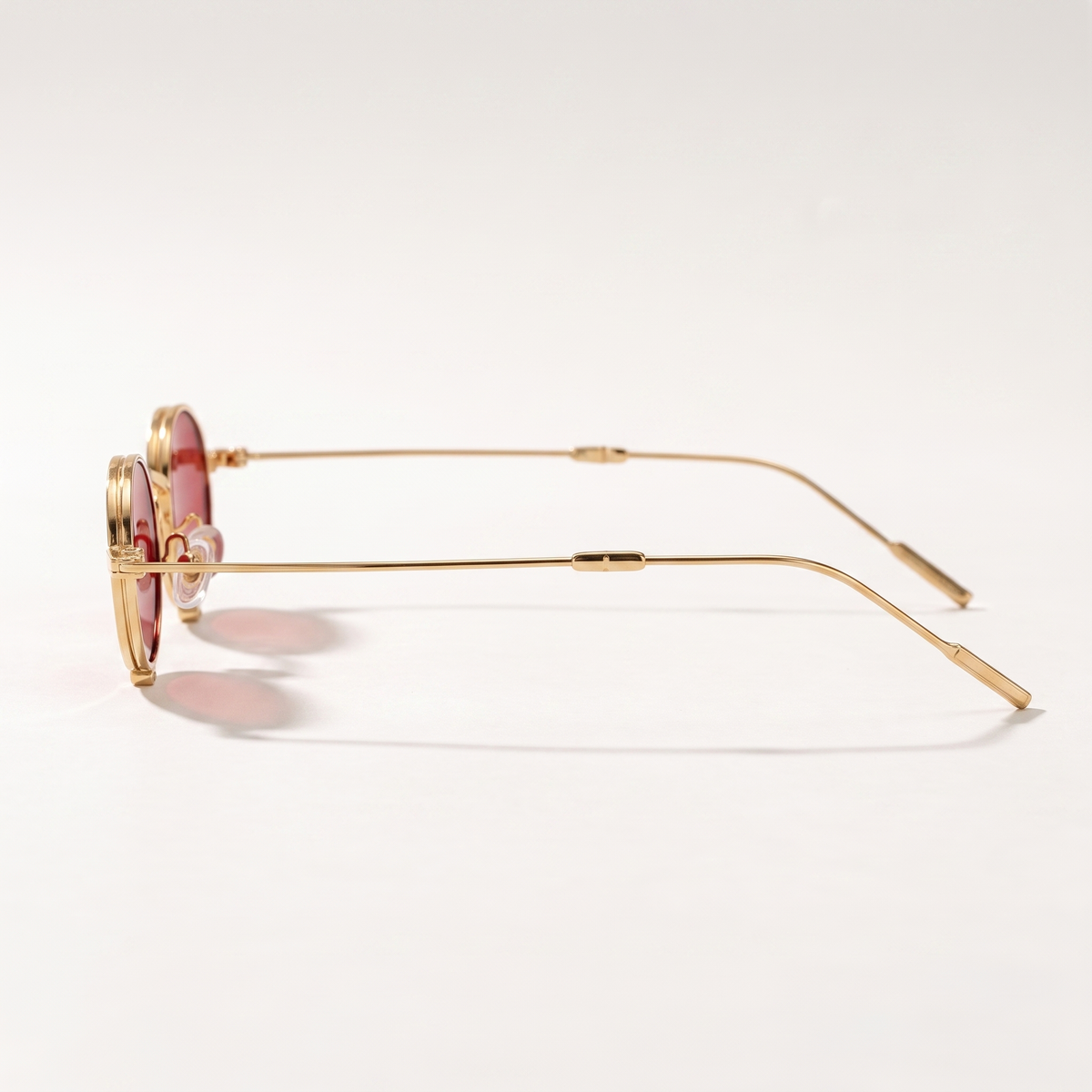 The Blank Tag Relic vintage micro round polarised sunglasses, gold with red tinted lens – angled view — view 3