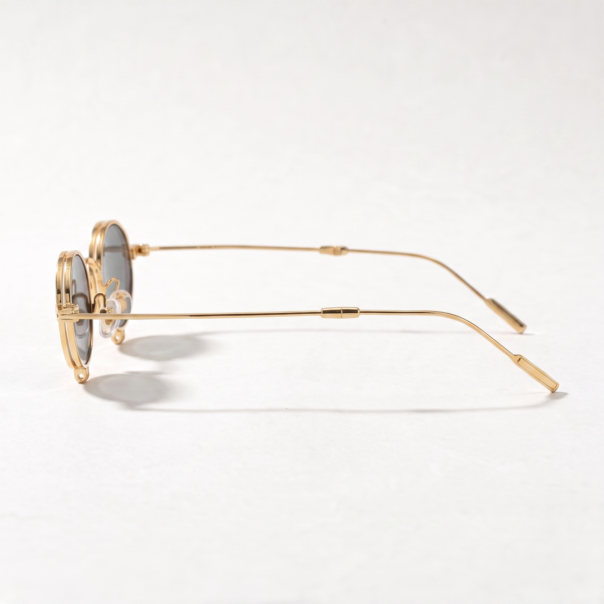 The Blank Tag Relic vintage micro round polarised sunglasses, gold with grey tinted lens – angled view — view 3