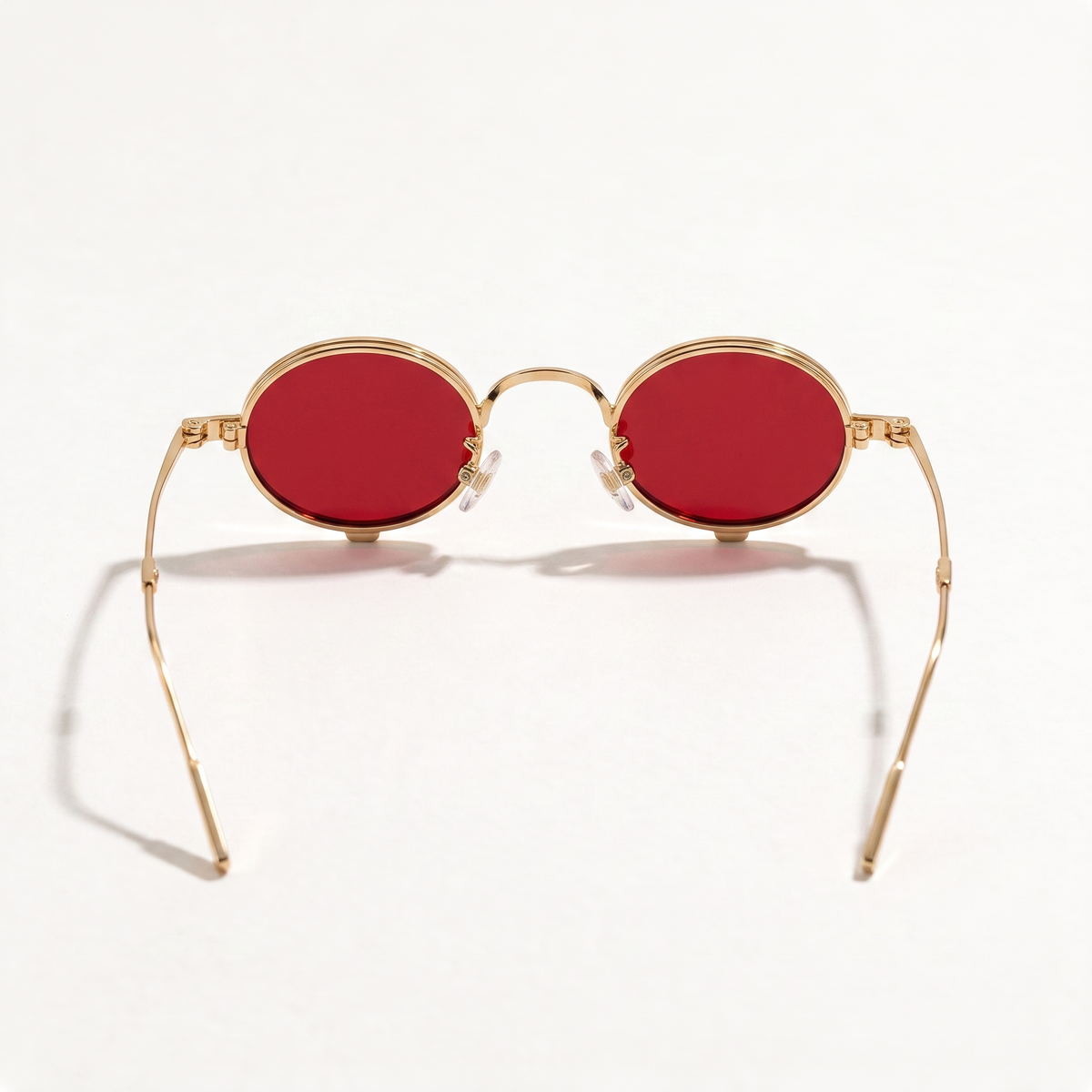 The Blank Tag Relic vintage micro round polarised sunglasses, gold with red tinted lens – detail view — view 4