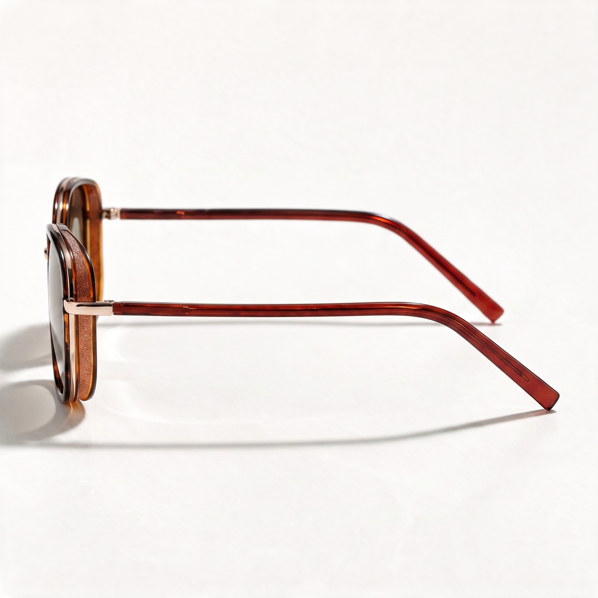 The Blank Tag Mosaic layered square polarised sunglasses for women, gold with translucent rim and brown gradient lens – angled view — view 3
