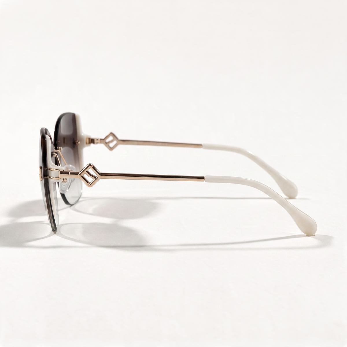 The Blank Tag Bloom rimless butterfly sunglasses for women, coffee with deep-to-clear gradient lens – side view — view 2