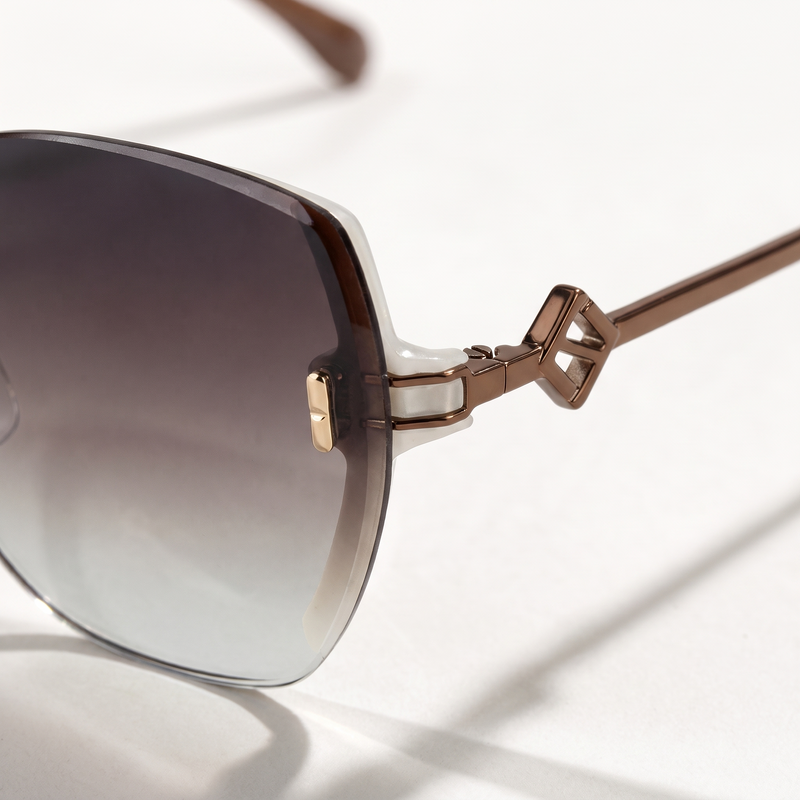 The Blank Tag Bloom rimless butterfly sunglasses for women, coffee with deep-to-clear gradient lens – angled view — view 3
