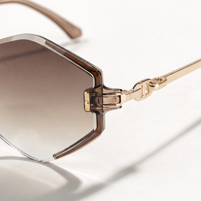 The Blank Tag Prism rimless geometric octagon sunglasses for women, gold with faceted brown gradient lens – side view — view 2