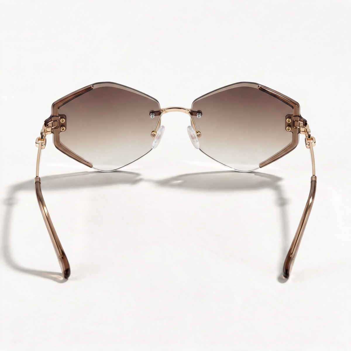 The Blank Tag Prism rimless geometric octagon sunglasses for women, gold with faceted brown gradient lens – detail view — view 4