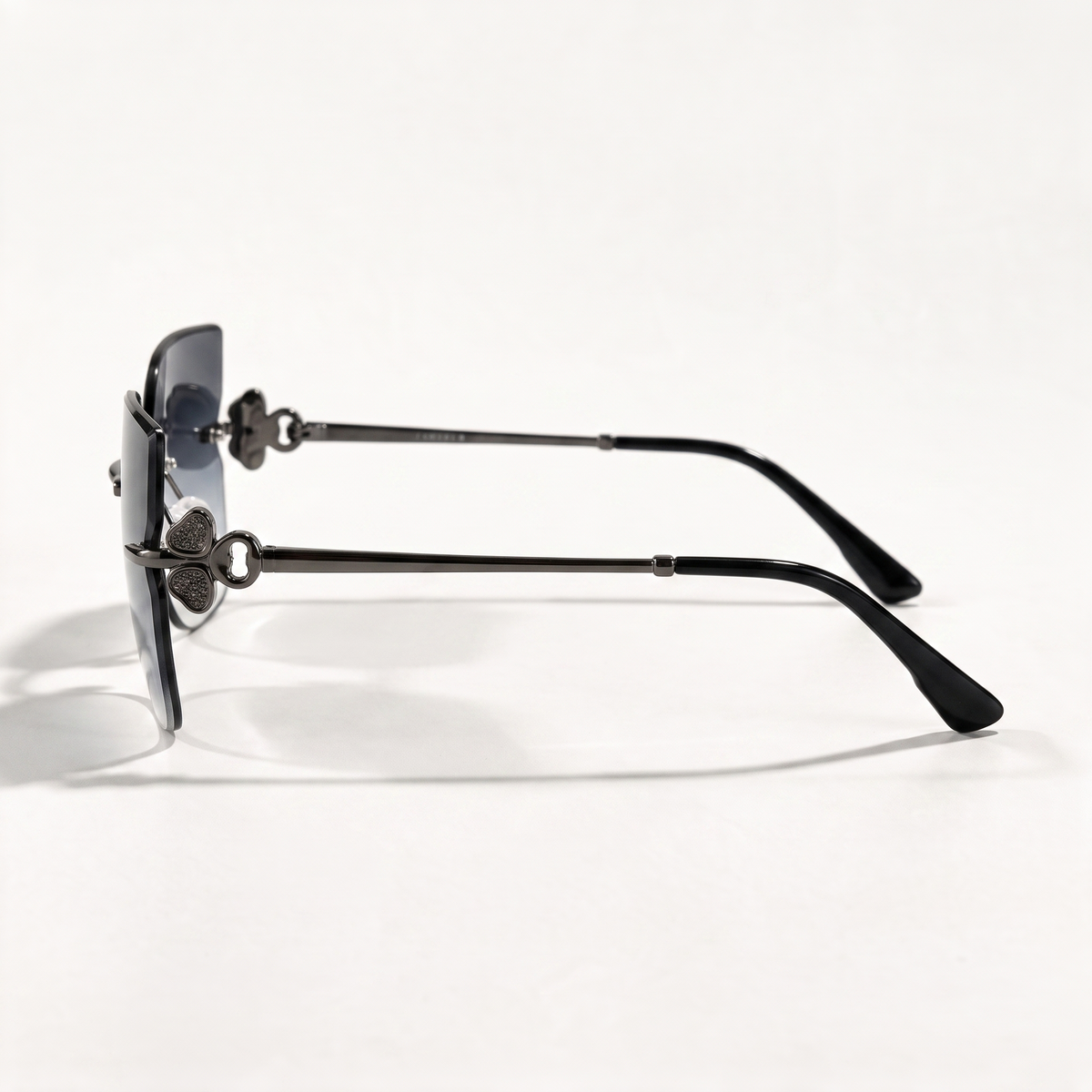 The Blank Tag Empress rimless square sunglasses for women, gun metal with smoky grey gradient lens – side view — view 2