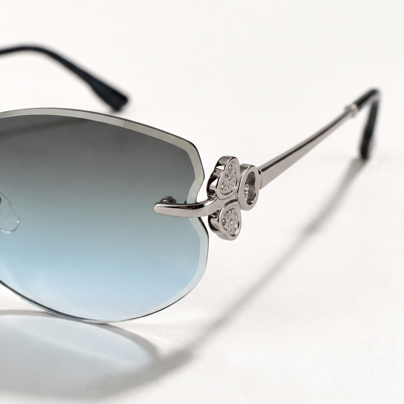 The Blank Tag Mermaid rimless oval sunglasses for women, light gun metal with grey-blue gradient lens – angled view — view 3