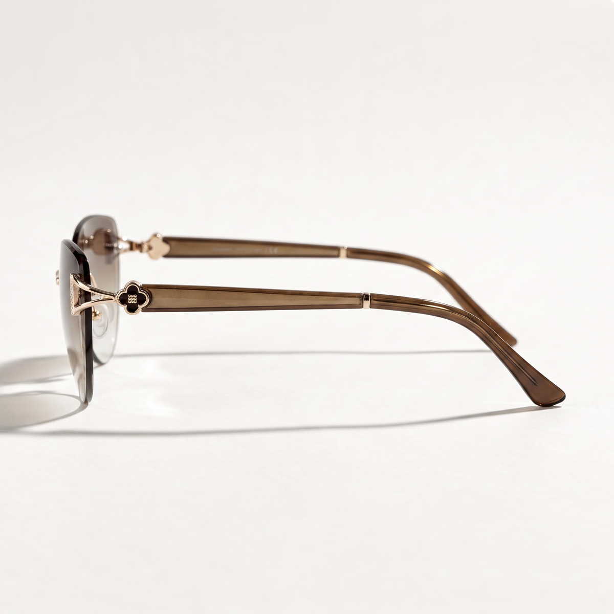 The Blank Tag Marquise oversized rimless cat-eye sunglasses for women, gold with brown gradient lens – side view — view 2