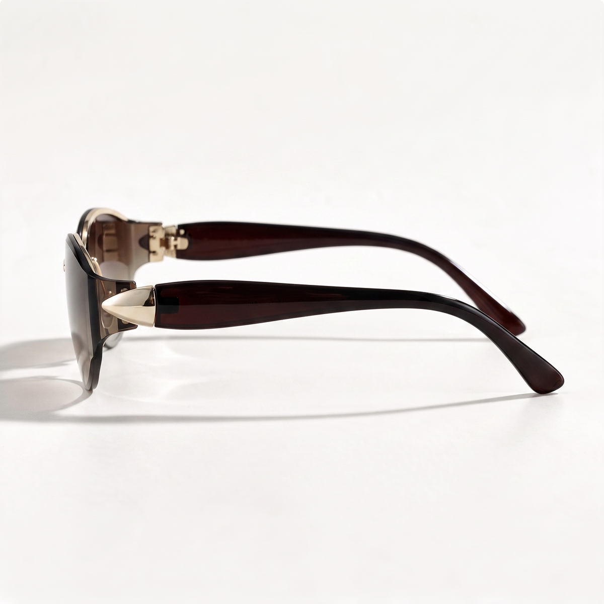 The Blank Tag Countess rimless wrap cat-eye sunglasses for women, gold with brown gradient lens – side view — view 2