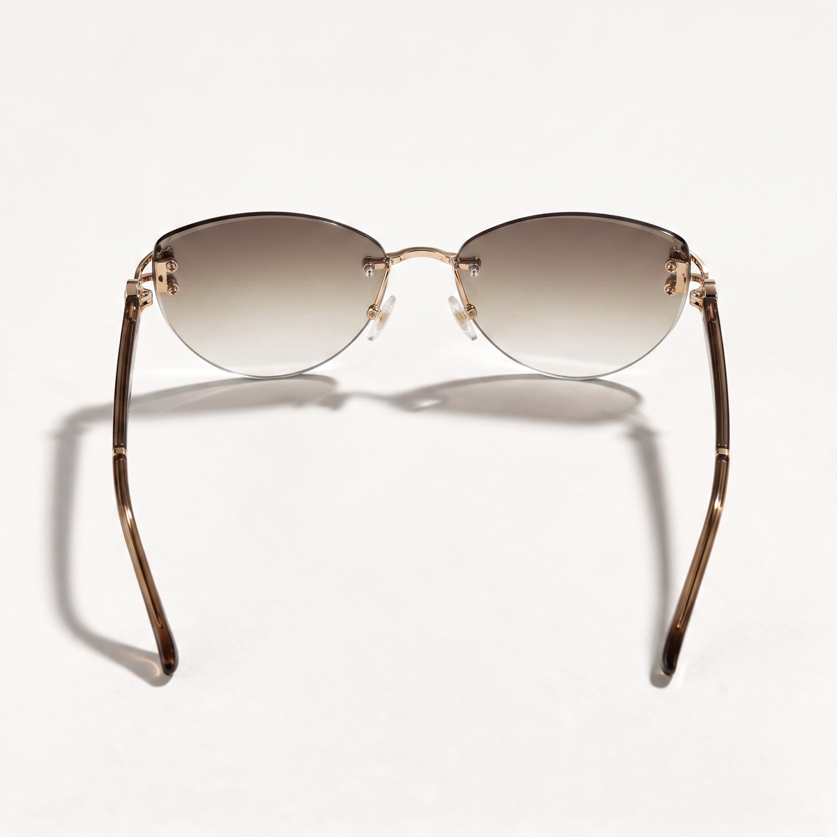 The Blank Tag Marquise oversized rimless cat-eye sunglasses for women, gold with brown gradient lens – angled view — view 3