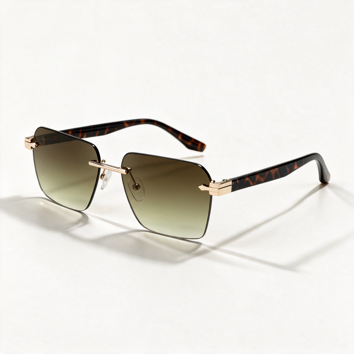 The Voyager rimless rectangle sunglasses in gold with gradient brown lenses — view 1